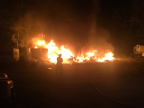 Trailers, boat, and shed engulfed in fire just south of Nelson