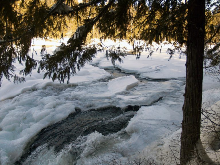 Excavator breaks up Duhamel Creek ice jam