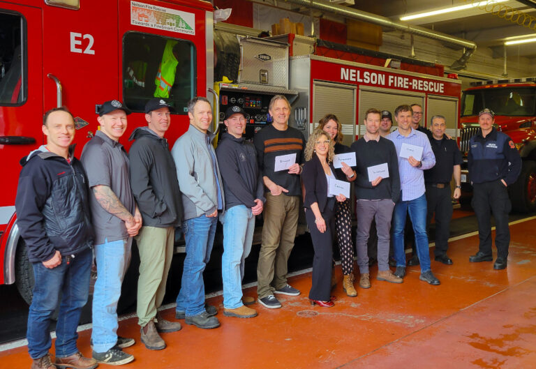 Nelson firefighters help feed SD8 elementary students