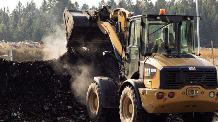 This is a photo of a truck moving compost