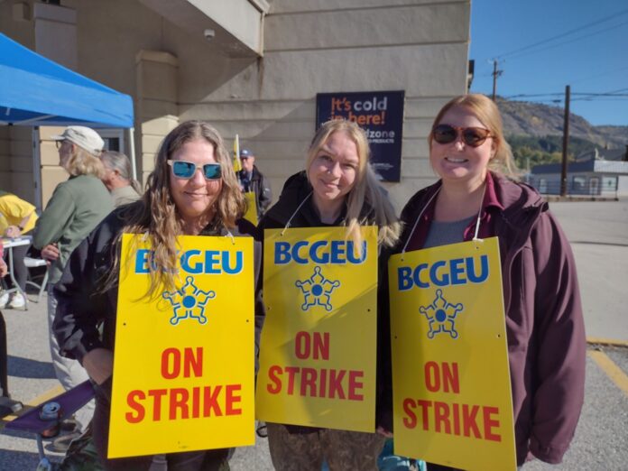 This is a photo of Trail workers on strike in front of the BC Liquor Store